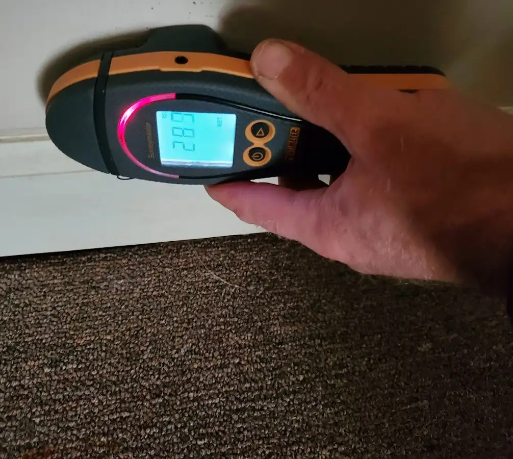 Moisture detection at baseboard during Storm Damage Restoration in Capitol View